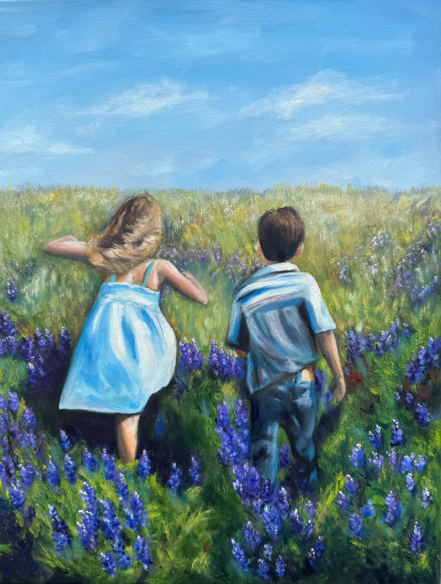 Running through a field of bluebonnets